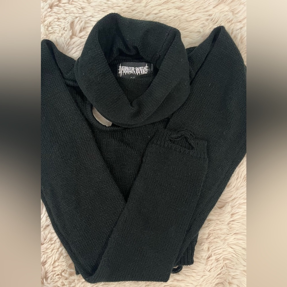 Edgy, long sleeve turtleneck shirt with cuts around the chest area